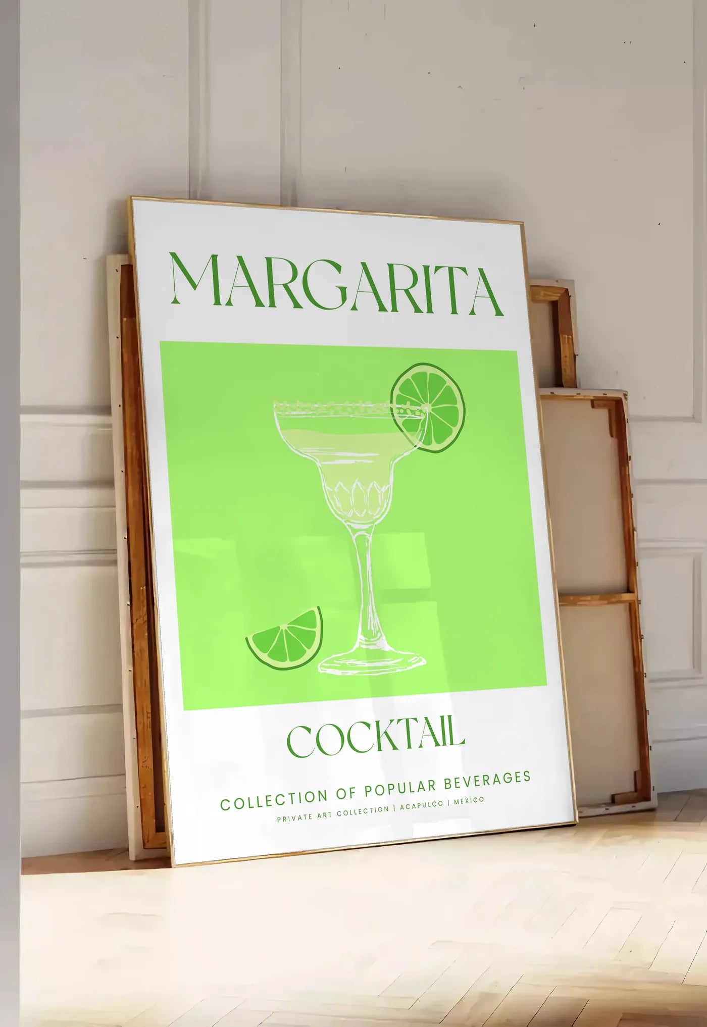 Tirage encadrable affiche margarita minimaliste, posee au sol dans une entree lumineuse, contre un mur a panneaux blancs, a cote de chassis en bois empiles