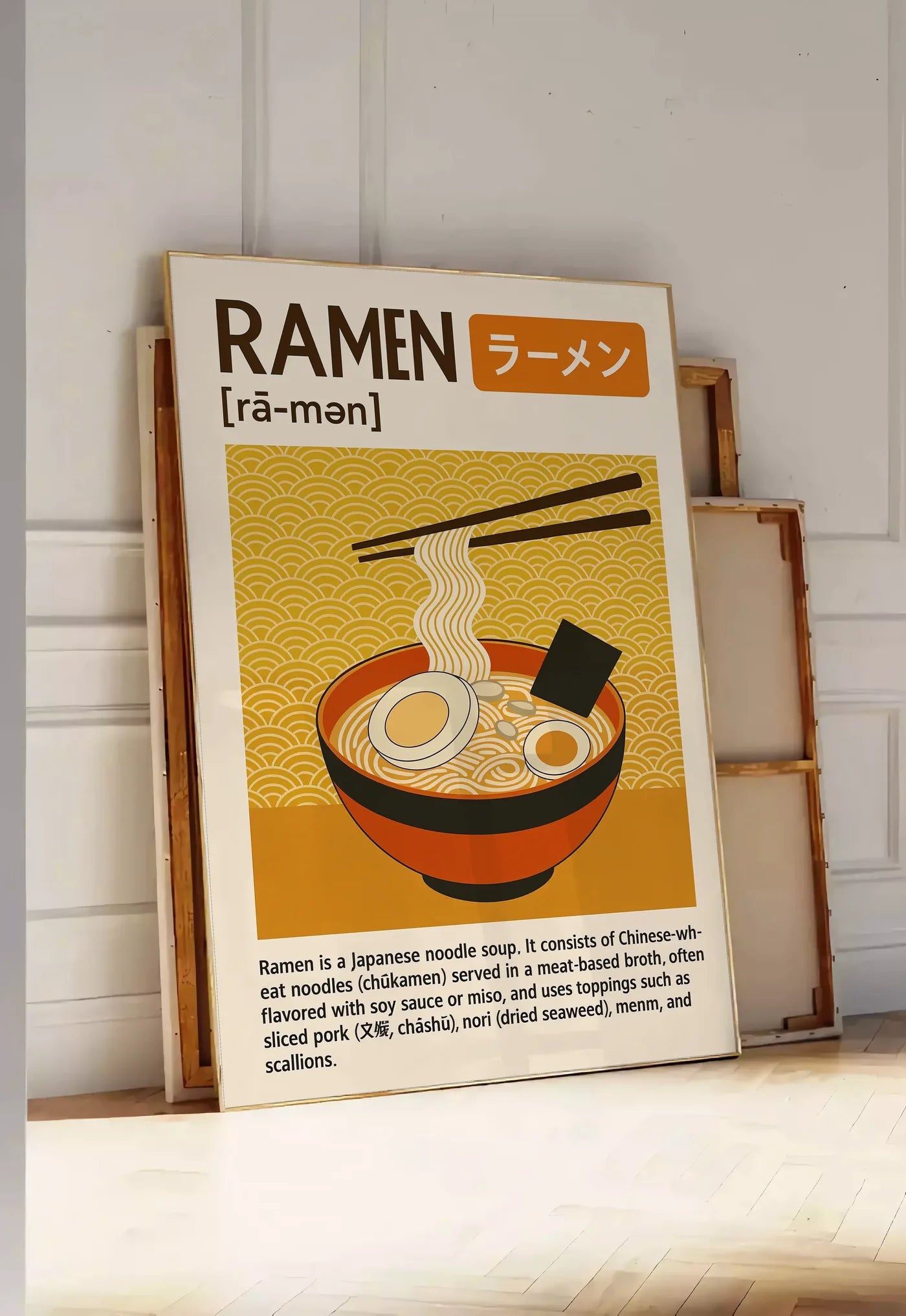 Tirage encadrable affiche ramen cuisine, posee au sol dans une entree lumineuse, contre un mur a panneaux blancs, a cote de chassis en bois empiles