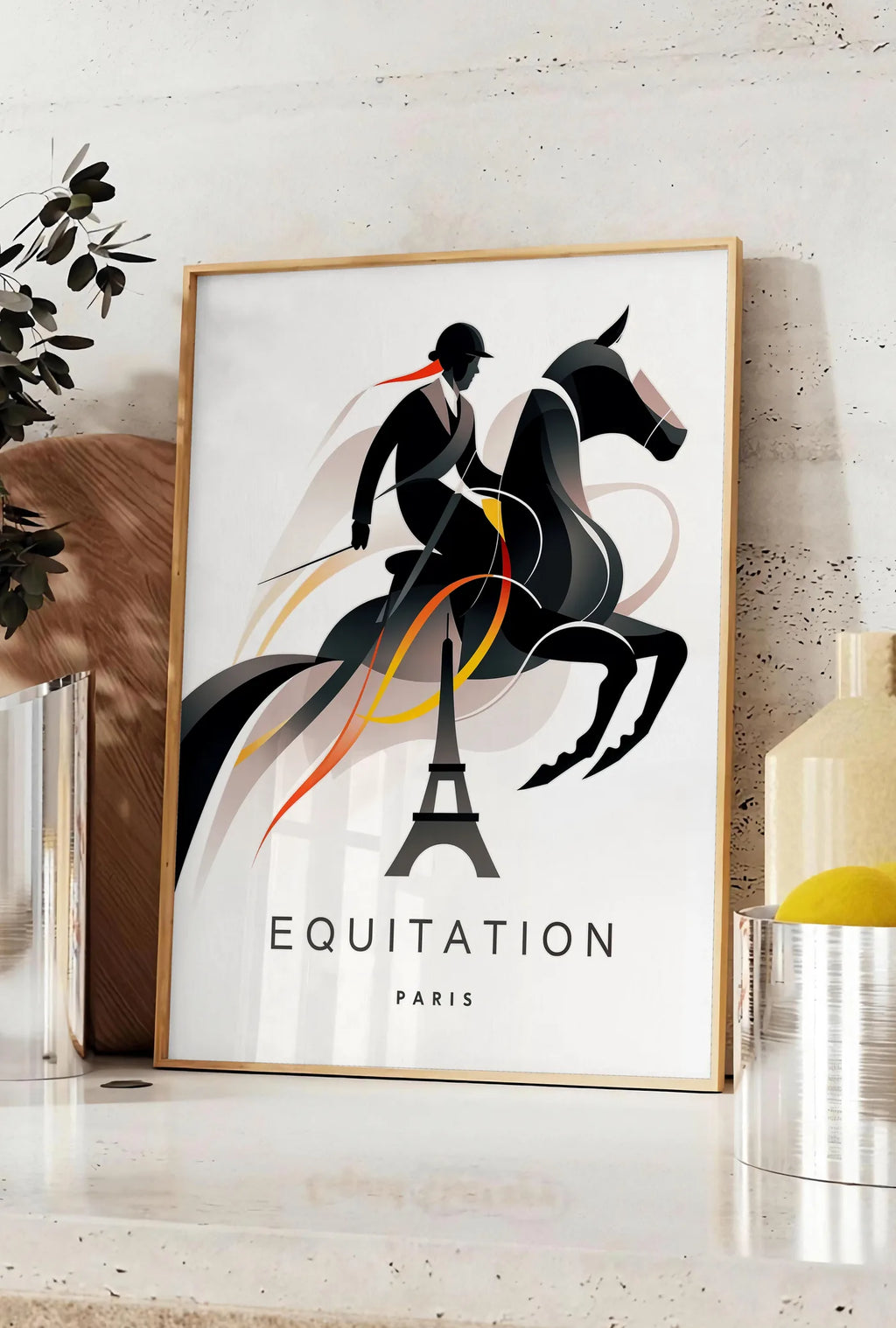 Affiche affiche equitation Paris, posee sur un plan de travail de cuisine en pierre claire, entre une branche d'eucalyptus en vase et un bocal de citrons