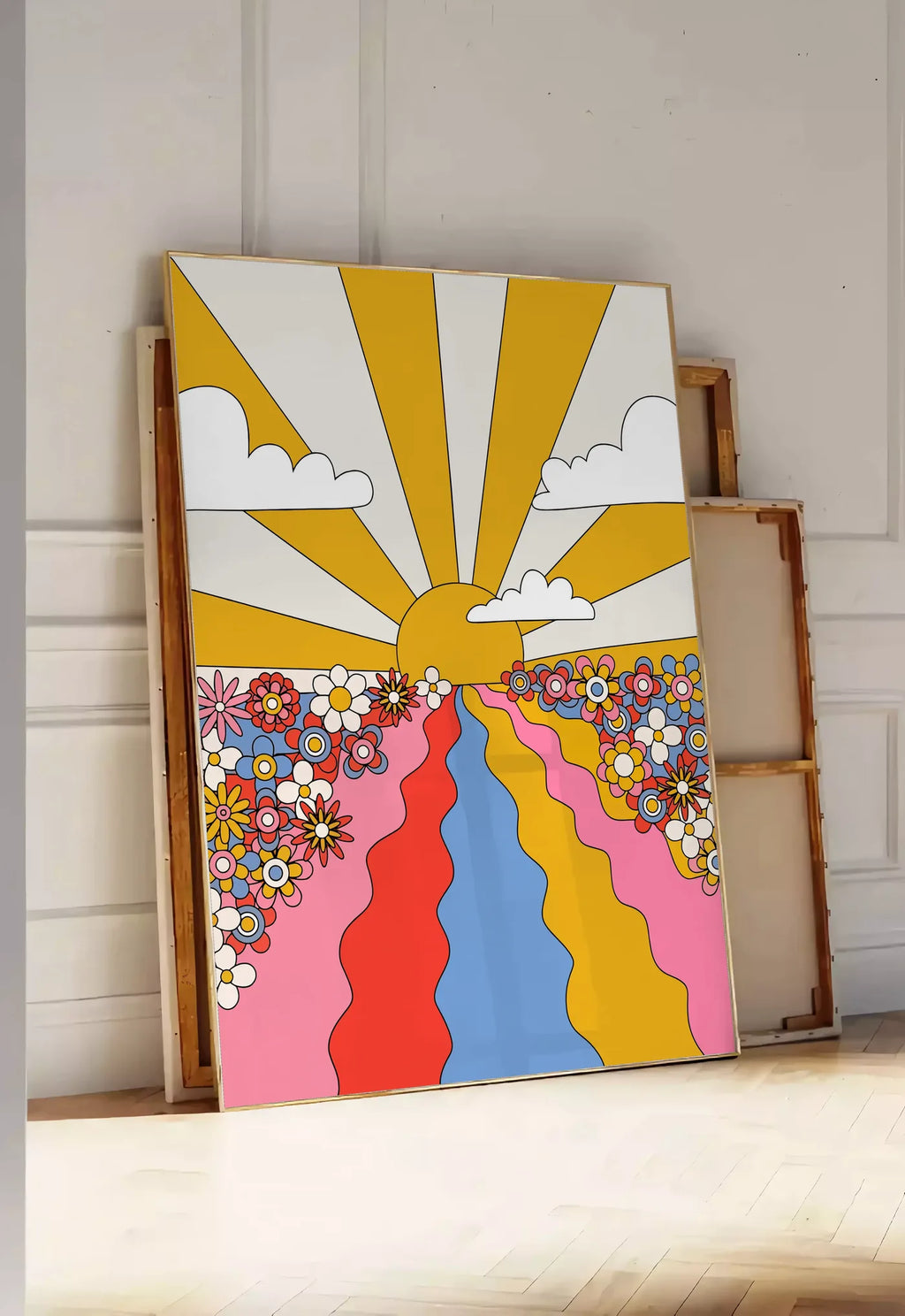 Tirage encadrable soleil aux rayons jaunes fleurs et chemin ondule, posee au sol dans une entree lumineuse, contre un mur a panneaux blancs, a cote de chassis en bois empiles
