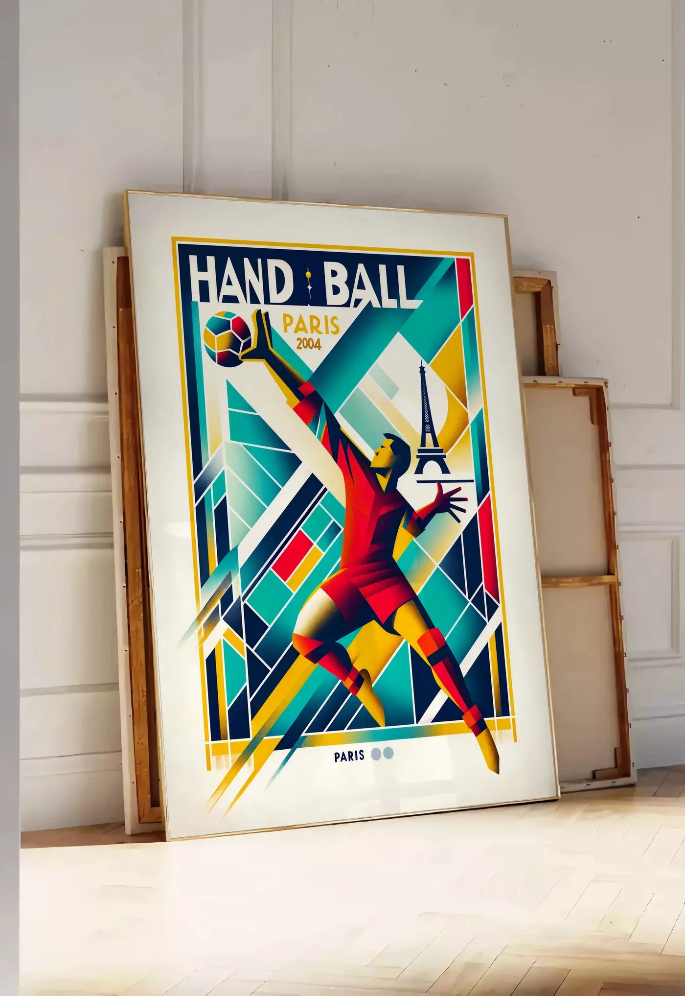 Tirage encadrable stylisé joueur de handball en saut, posee au sol dans une entree lumineuse, contre un mur a panneaux blancs, a cote de chassis en bois empiles