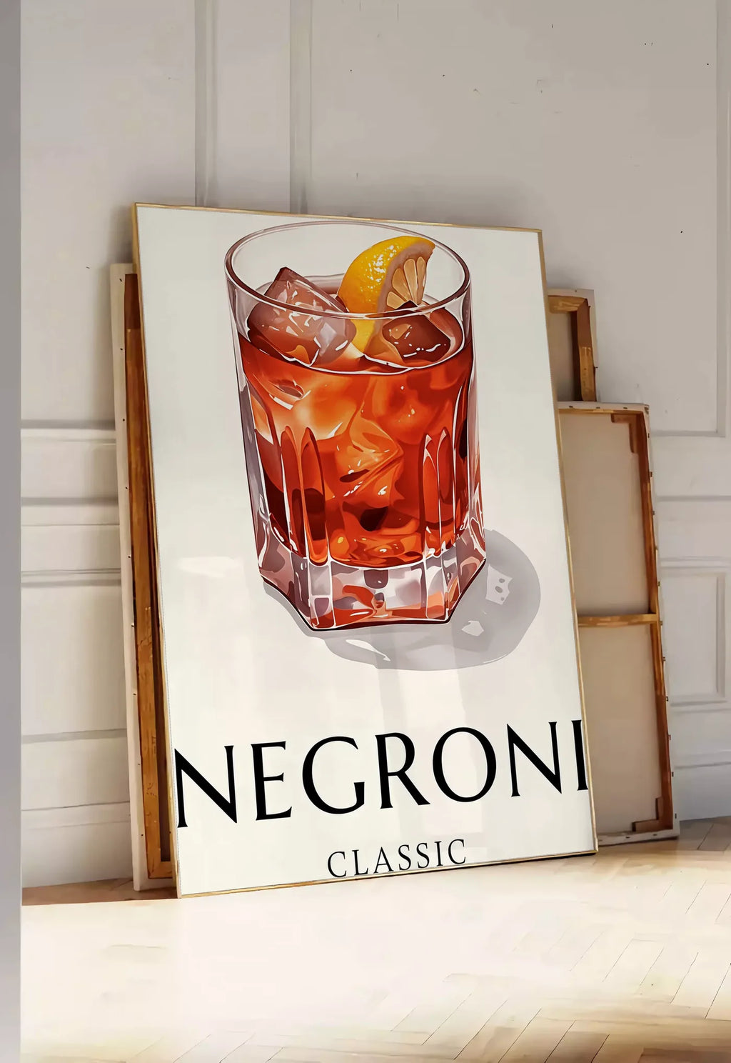 Tirage encadrable affiche cocktail Negroni, posee au sol dans une entree lumineuse, contre un mur a panneaux blancs, a cote de chassis en bois empiles