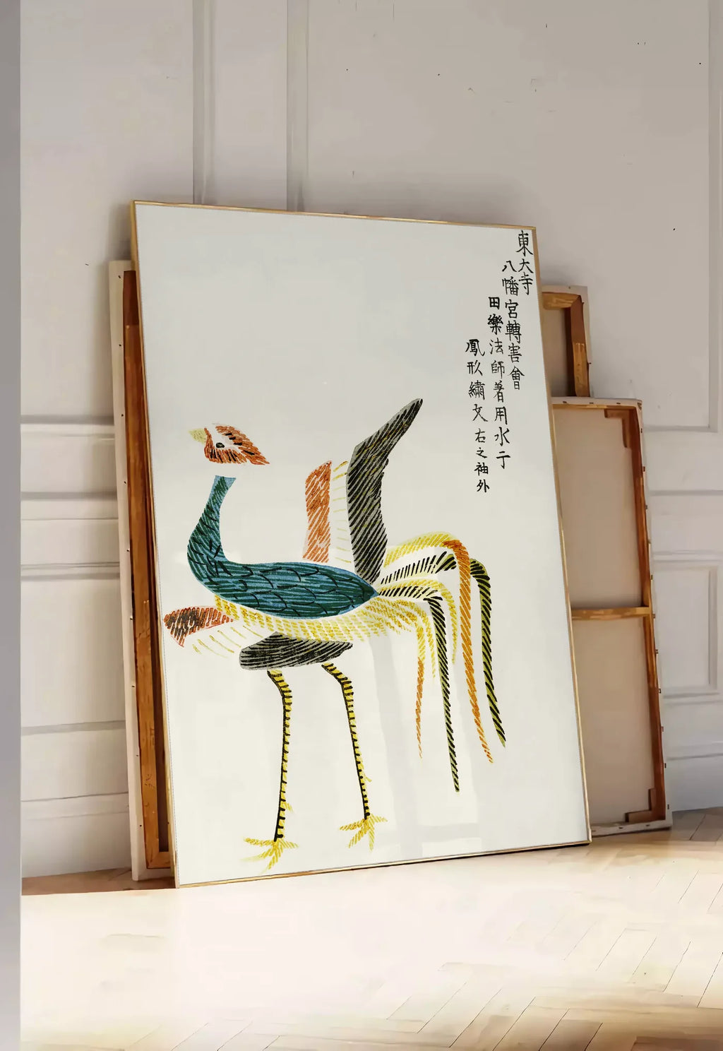 Tirage encadrable affiche grues stylisees vintage art japonais, posee au sol dans une entree lumineuse, contre un mur a panneaux blancs, a cote de chassis en bois empiles