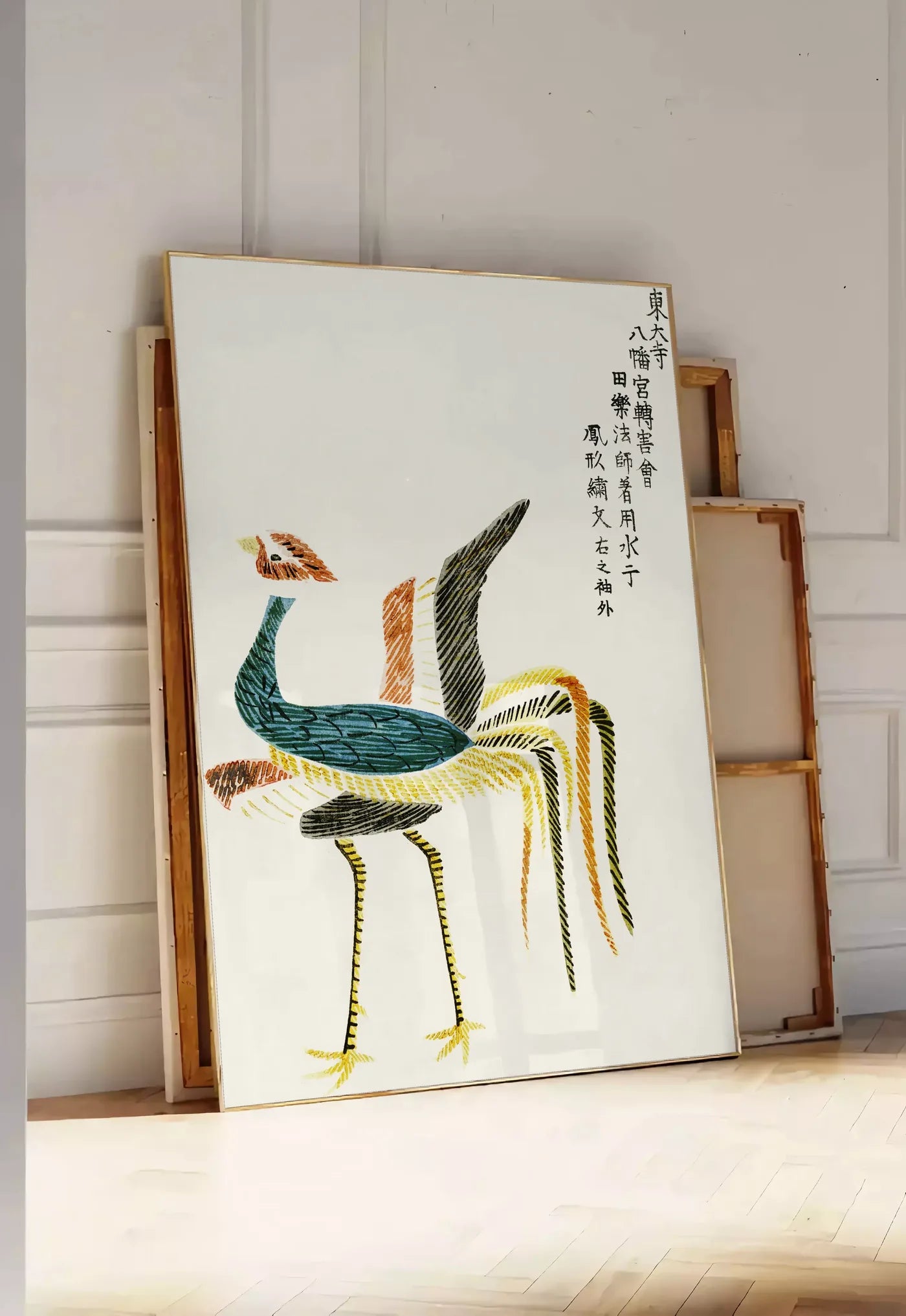 Tirage encadrable affiche grues stylisees vintage art japonais, posee au sol dans une entree lumineuse, contre un mur a panneaux blancs, a cote de chassis en bois empiles