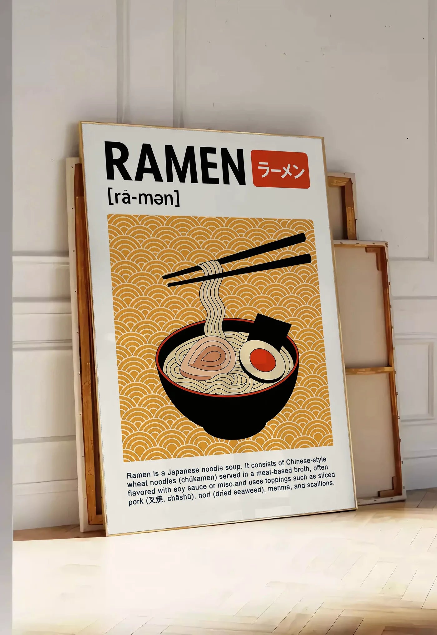 Tirage encadrable affiche cuisine ramen japonais, posee au sol dans une entree lumineuse, contre un mur a panneaux blancs, a cote de chassis en bois empiles