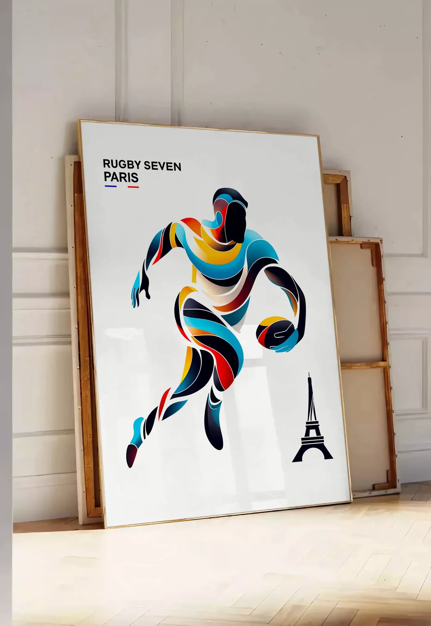 Tirage encadrable affiche rugby Paris, posee au sol dans une entree lumineuse, contre un mur a panneaux blancs, a cote de chassis en bois empiles
