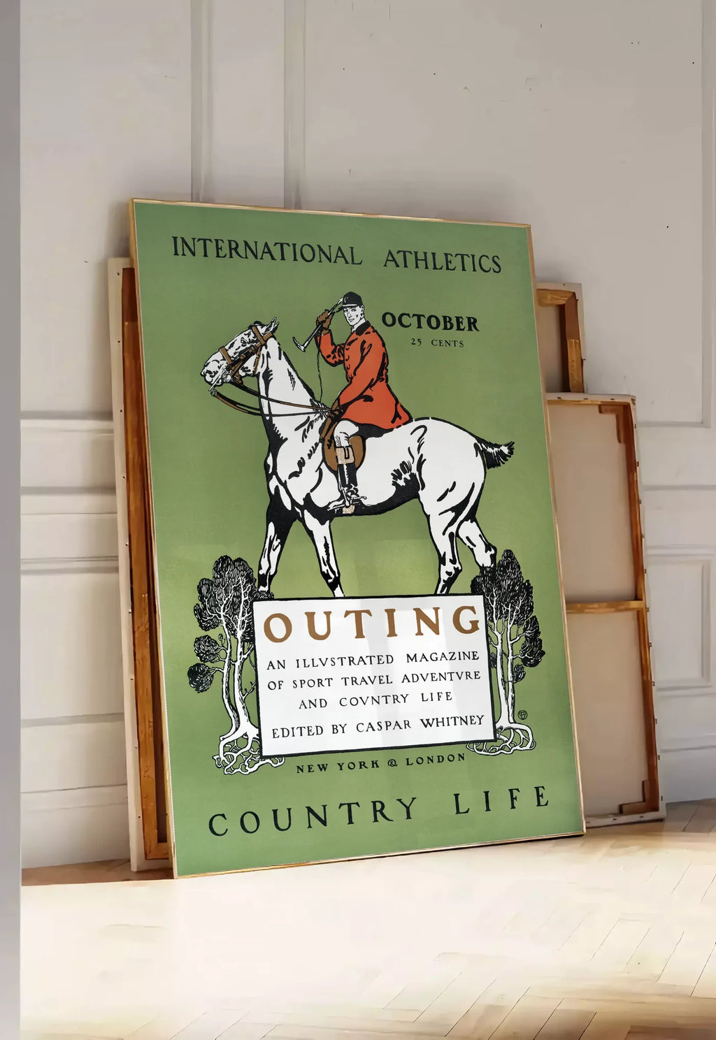 Tirage encadrable affiche Outing vintage, posee au sol dans une entree lumineuse, contre un mur a panneaux blancs, a cote de chassis en bois empiles