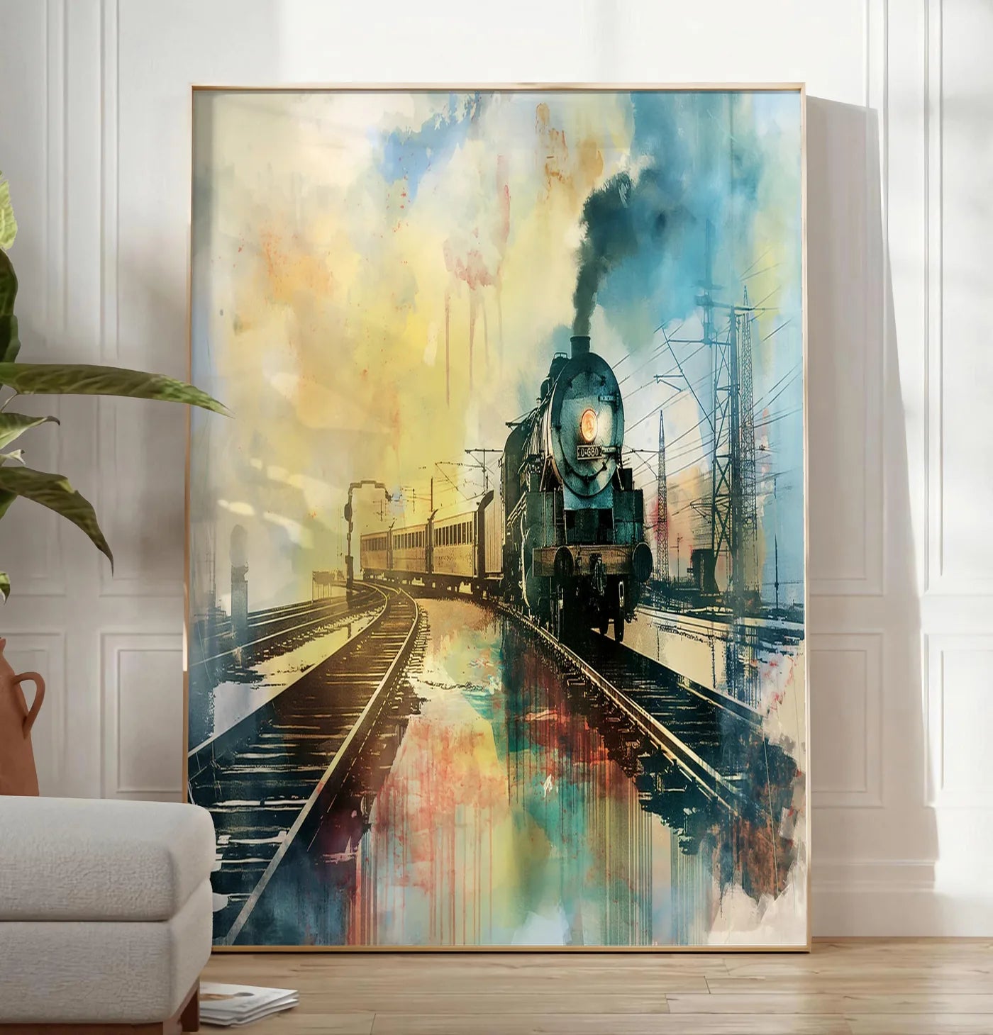 Reproduction affiche train vapeur vintage, posee au sol dans un salon minimaliste clair, a cote d'un canape beige et d'une plante verte, sur un parquet clair