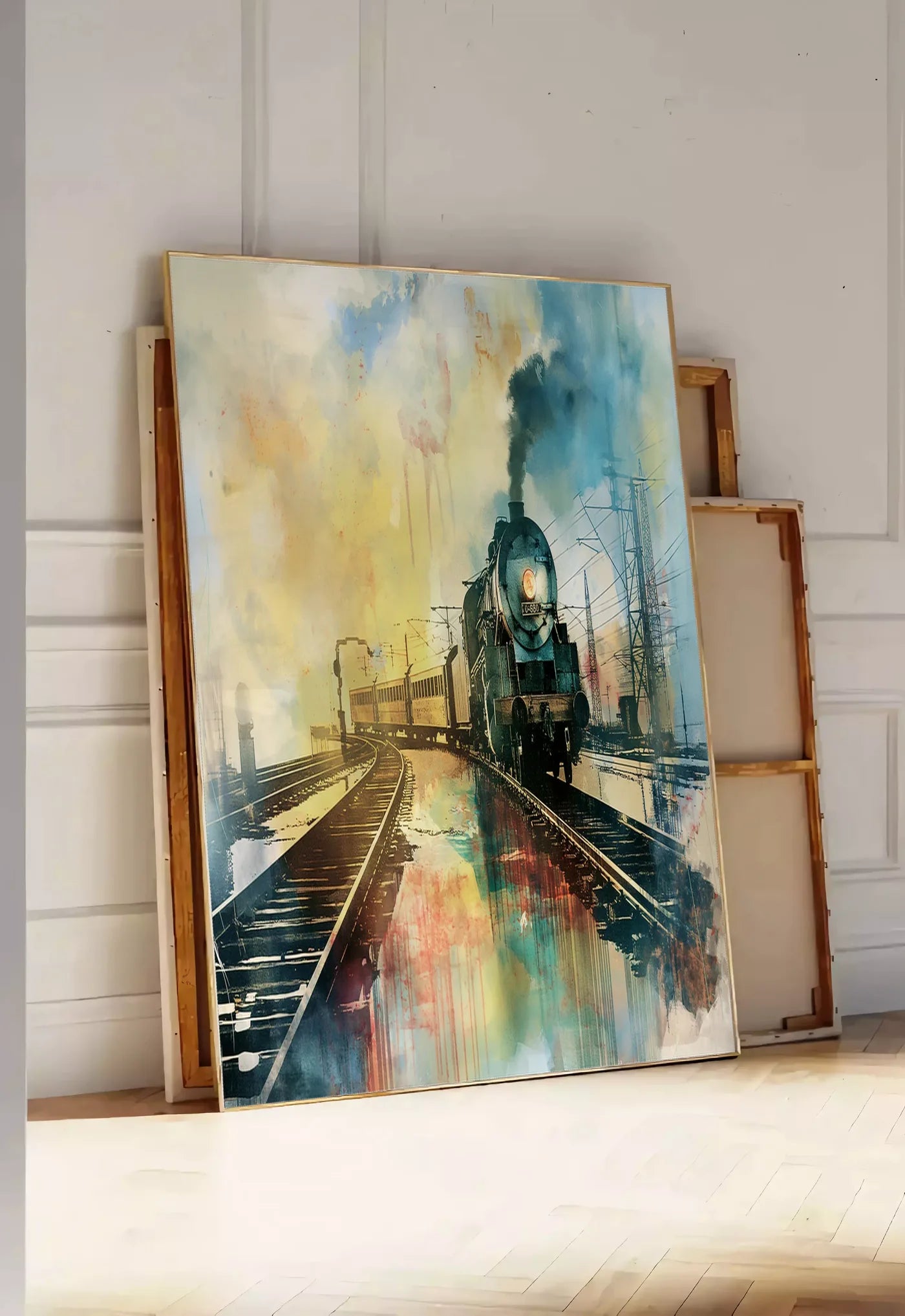 Tirage encadrable affiche train vapeur vintage, posee au sol dans une entree lumineuse, contre un mur a panneaux blancs, a cote de chassis en bois empiles